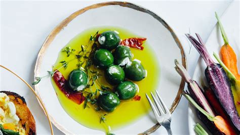 cheese-stuffed-olives-recipe-bon-apptit image