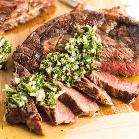 grilled-steak-with-chimichurri-sauuce-lemon-blossoms image