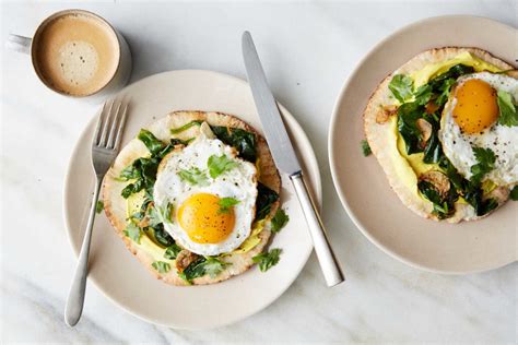 indian-spiced-eggs-with-spinach-and-turmeric-yogurt image