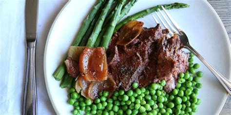 slow-cooker-pot-roast-with-peas-and-asparagus-delish image