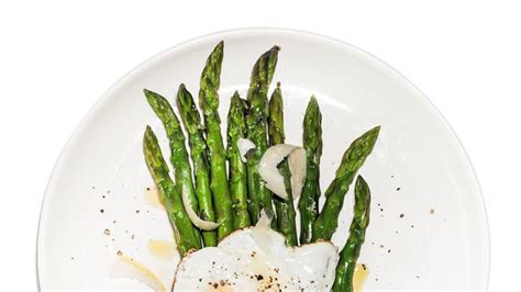 asparagus-with-fried-eggs-recipe-bon-apptit image