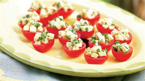 cherry-tomatoes-stuffed-with-mozzarella-basil image