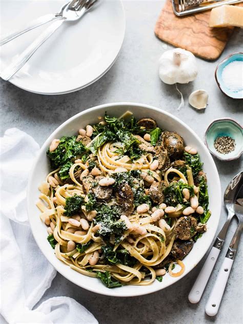 fettuccine-with-chicken-sausage-kale-and-cannellini-beans image