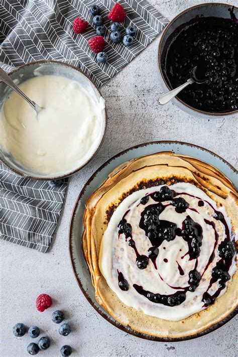 blueberry-crepes-with-cream-cheese-filling-neighborfood image