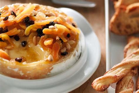 baked-canadian-camembert-with-pine-nuts-and-apricots image