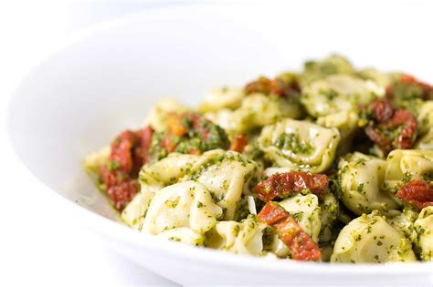 cheese-tortellini-with-pesto-and-sun-dried-tomatoes image