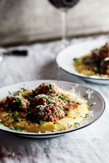 meatballs-baked-in-tomato-sauce-on-polenta-simply image