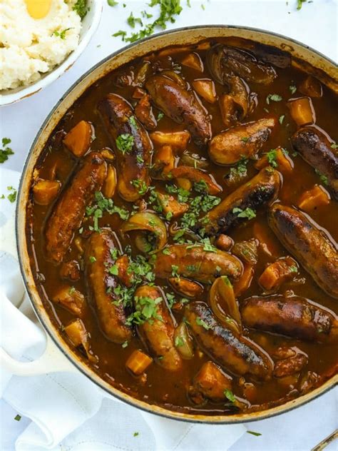 sausage-casserole-with-cider-gravy-and-crispy-bacon image