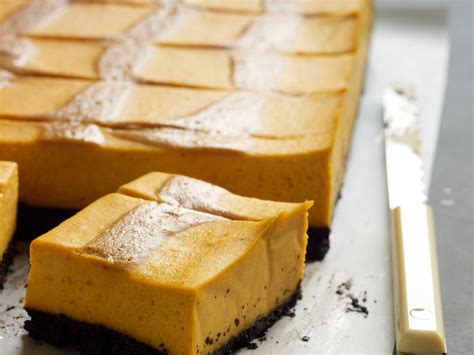 pumpkin-cheesecake-bars-with-caramel-swirl image