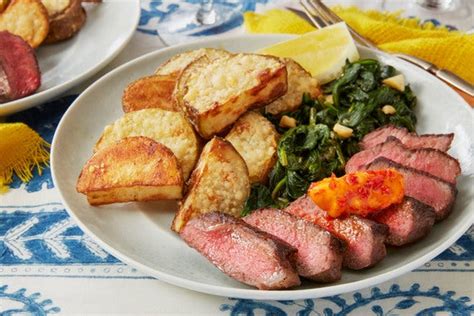 chile-butter-steaks-with-parmesan-potatoes-spinach image