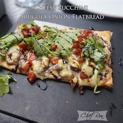 cheesy-zucchini-arugula-onion-flatbread-all-food image