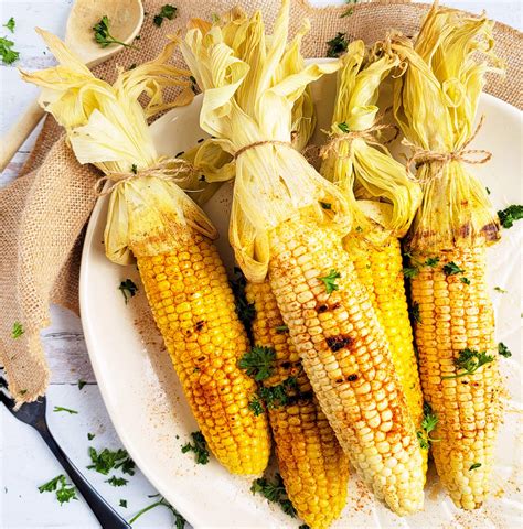spicy-grilled-corn-on-the-cob-recipe-eatingwell image