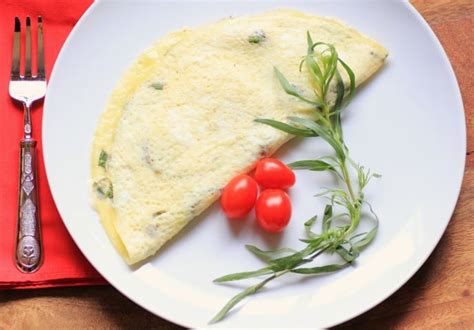 herb-and-brie-omelette-for-brunchweek-noshing image