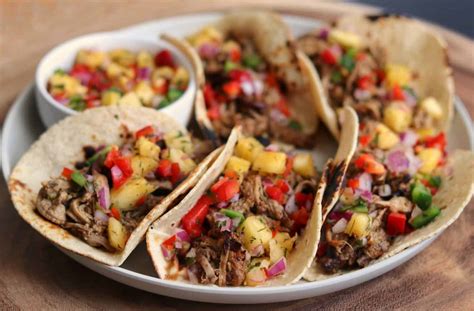 jerk-pork-tenderloin-tacos-with-pineapple-salsa image