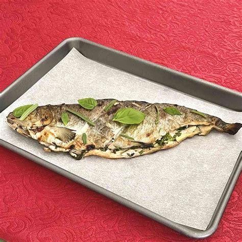 basil-rosemary-grilled-trout-recipe-the-spruce-eats image