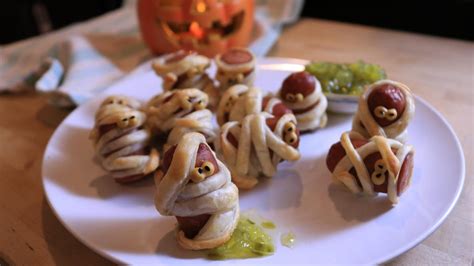 make-these-mummy-pigs-in-a-blankets-for-halloween image