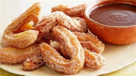 cinnamon-churros-with-mexican-chocolate-dipping-sauce image