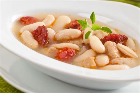 spanish-white-beans-with-chorizo-recipe-the-spruce image