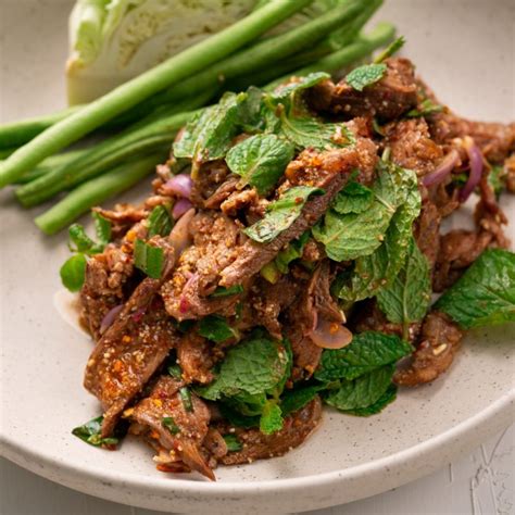 spicy-thai-grilled-beef-salad-nam-tok-nuea-marions image