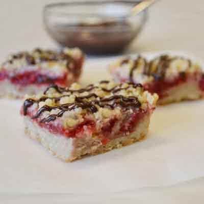 chocolate-drizzled-cherry-bars-recipe-land-olakes image