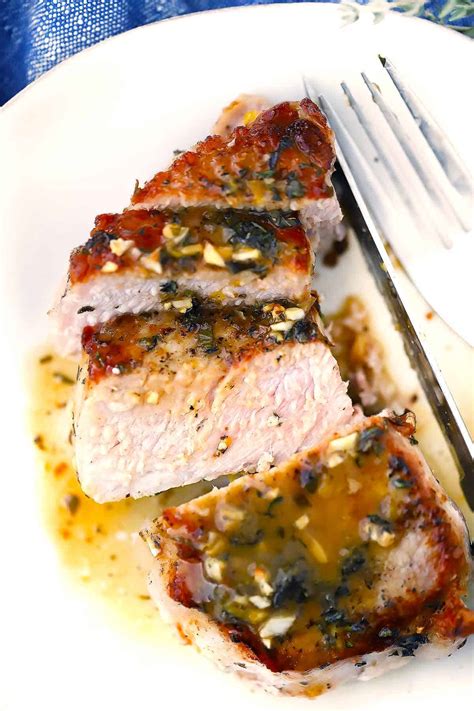 juicy-oven-baked-pork-chops-with-garlic-lemon image