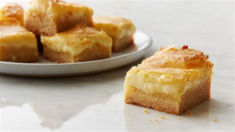 ooey-gooey-butter-cake-bars-recipe-tablespooncom image