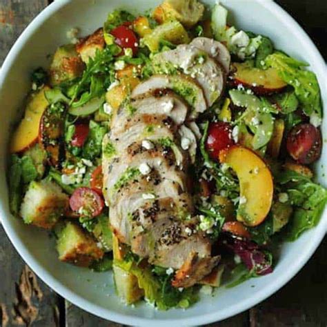 summer-panzanella-salad-recipe-with-pesto-vinaigrette image