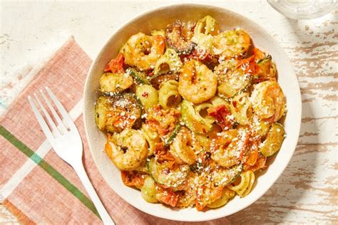 creamy-pesto-shrimp-pasta-with-tomatoes-zucchini image