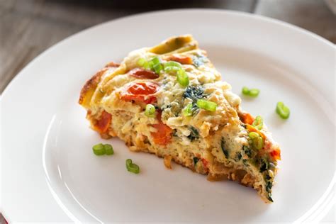 spinach-tomato-frittata-with-goat-cheese-grain image
