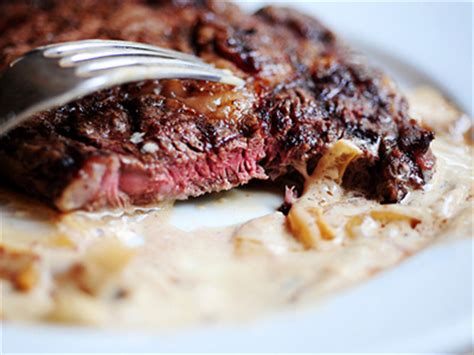 grilled-ribeye-steak-with-onion-blue-cheese-sauce image