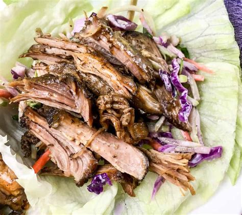 slow-cooker-pulled-pork-lettuce-wraps-low-carb-this image