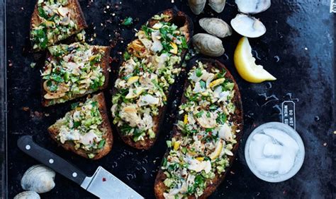 grilled-clam-toasts-with-lemon-and-green-olives image
