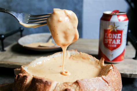 impossibly-cheesy-beer-cheese-dip-in-a-bread-bowl image