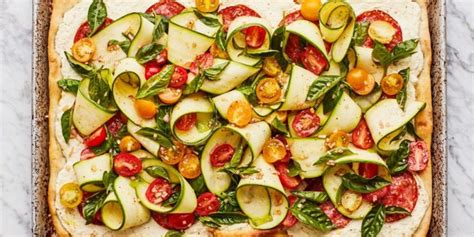 summer-pizza-with-salami-zucchini-and-tomatoes image