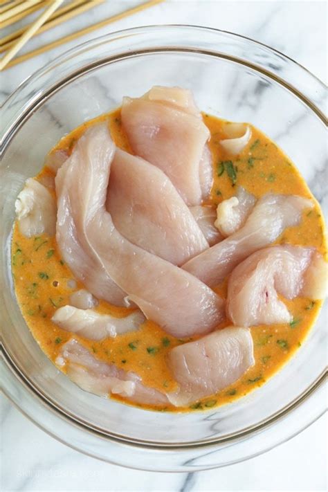 chicken-satay-with-spicy-peanut-sauce-recipe-skinnytaste image