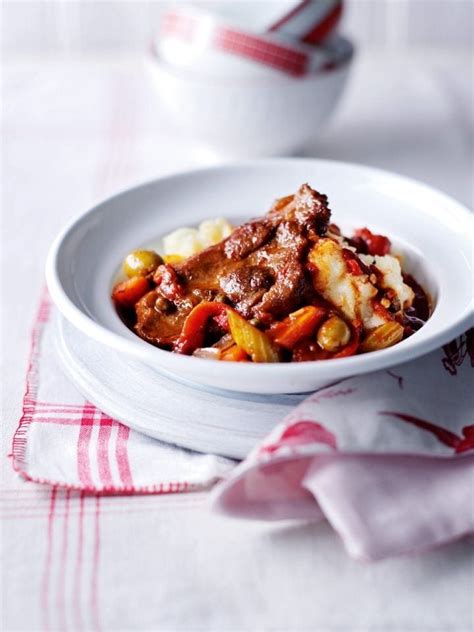 spanish-style-pork-with-olives-and-peppers-delicious image