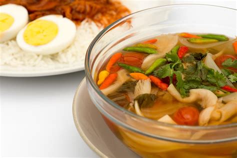 vegetarian-tom-yum-soup-recipe-by-archanas image