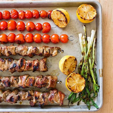 spice-grilled-pork-skewers-with-grilled-tomato-relish image
