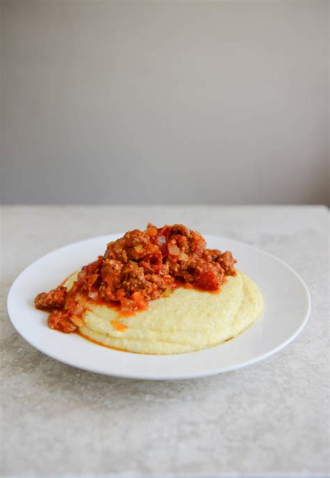 creamy-polenta-with-garden-tomato-sauce-and-sausage image