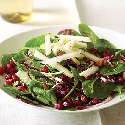 spinach-pomegranate-salad-with-pears-hazelnuts image