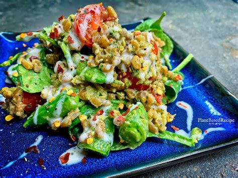 kale-pesto-and-farro-salad-with-tomatoes-spinach-and image