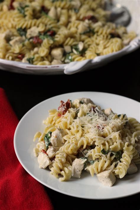 creamy-chicken-pasta-with-spinach-and-tomatoes image