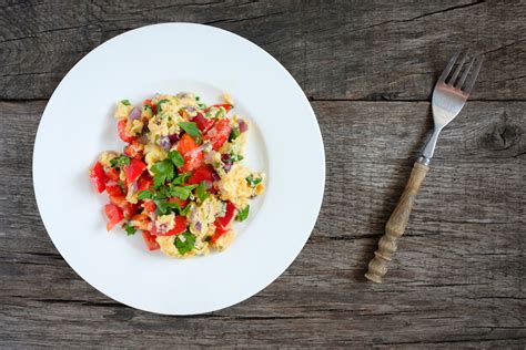 scrambled-eggs-with-tomatoes-herbs-and-goat-cheese image