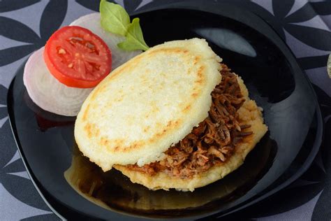 arepas-with-pulled-pork-and-cilantro-garlic image
