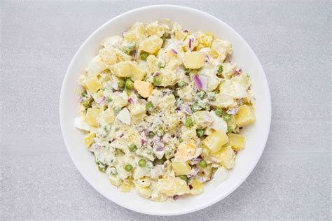 potato-salad-recipe-with-eggs-and-peas-the-spruce image