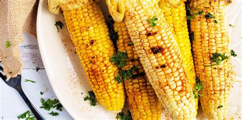 spicy-grilled-corn-on-the-cob-eatingwell image