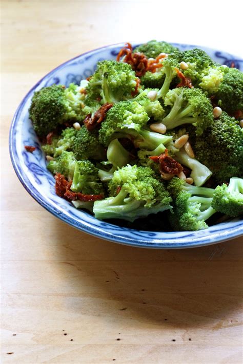 steamed-broccoli-with-sun-dried-tomatoes-and-pine-nuts image