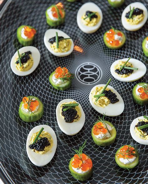 deviled-eggs-with-chives-and-caviar-flower-magazine image