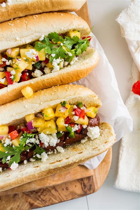 hoisin-glazed-hot-dogs-with-fresh-pineapple-salsa image