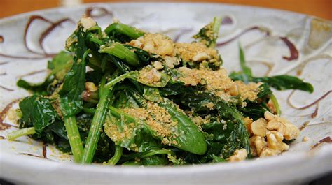 stir-fried-spinach-with-walnuts-and-flax-flakes image